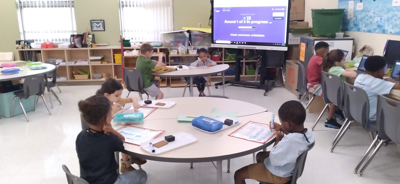 Jerusha Terry guiding students with hands-on literacy instruction