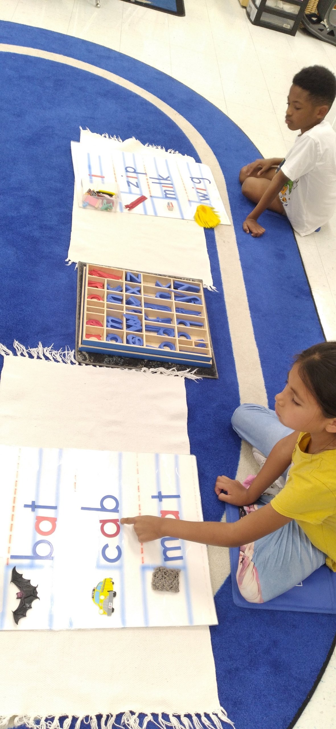 Preschool child engaged in hands-on fine-motor learning