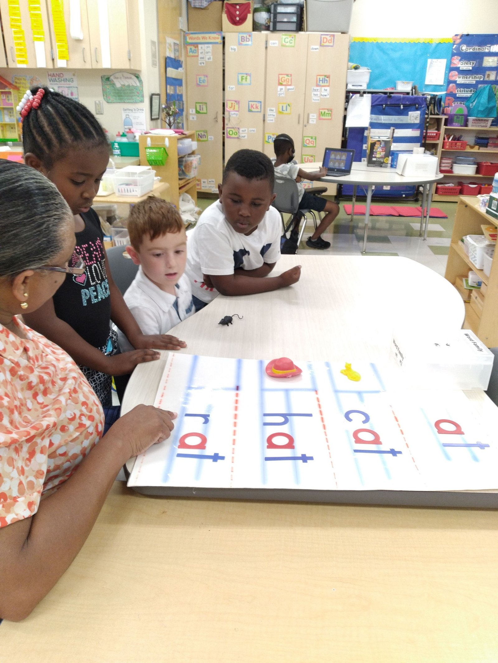 Children working together with Montessori-inspired materials