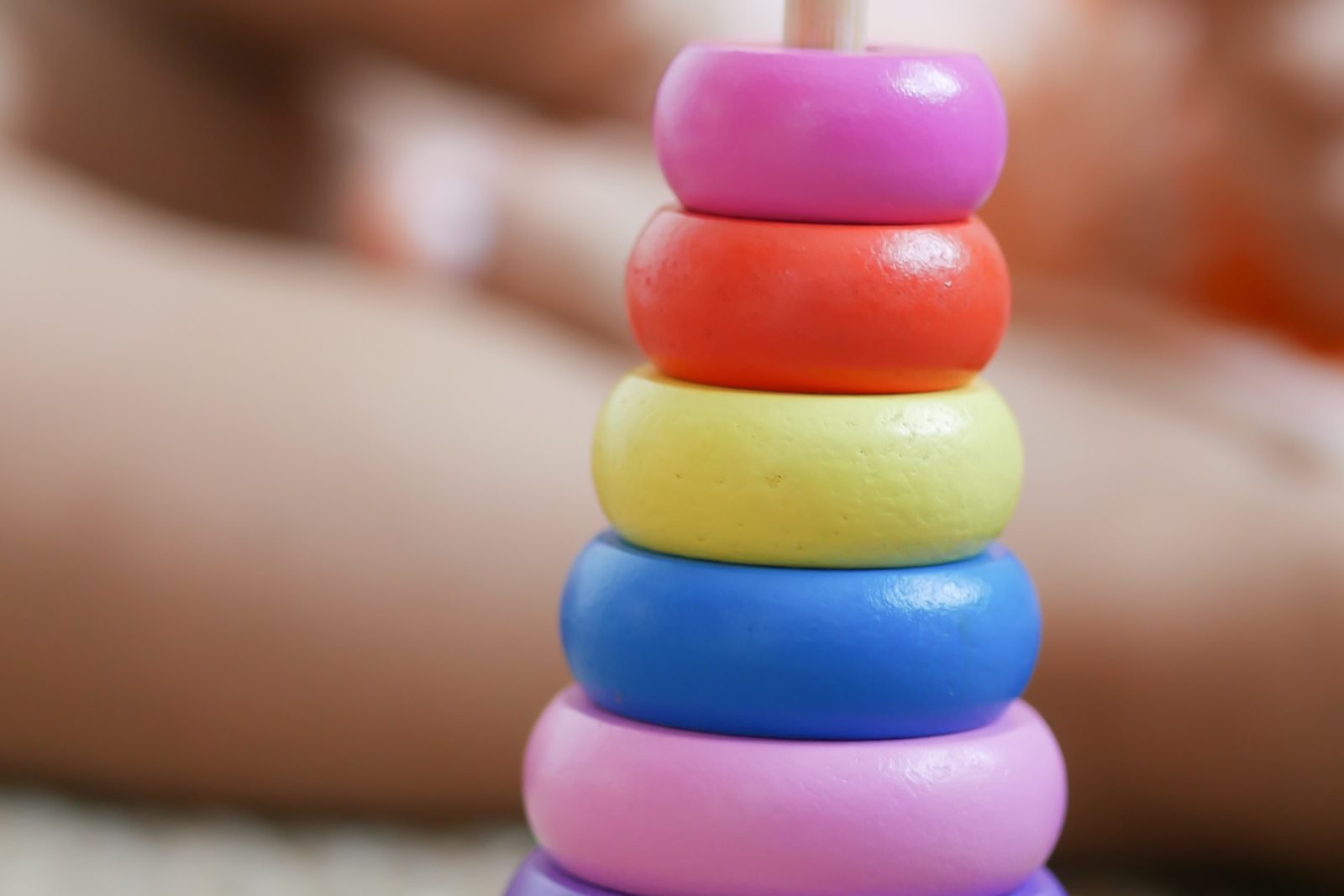 Colorful wooden ring stacker for purposeful repetition