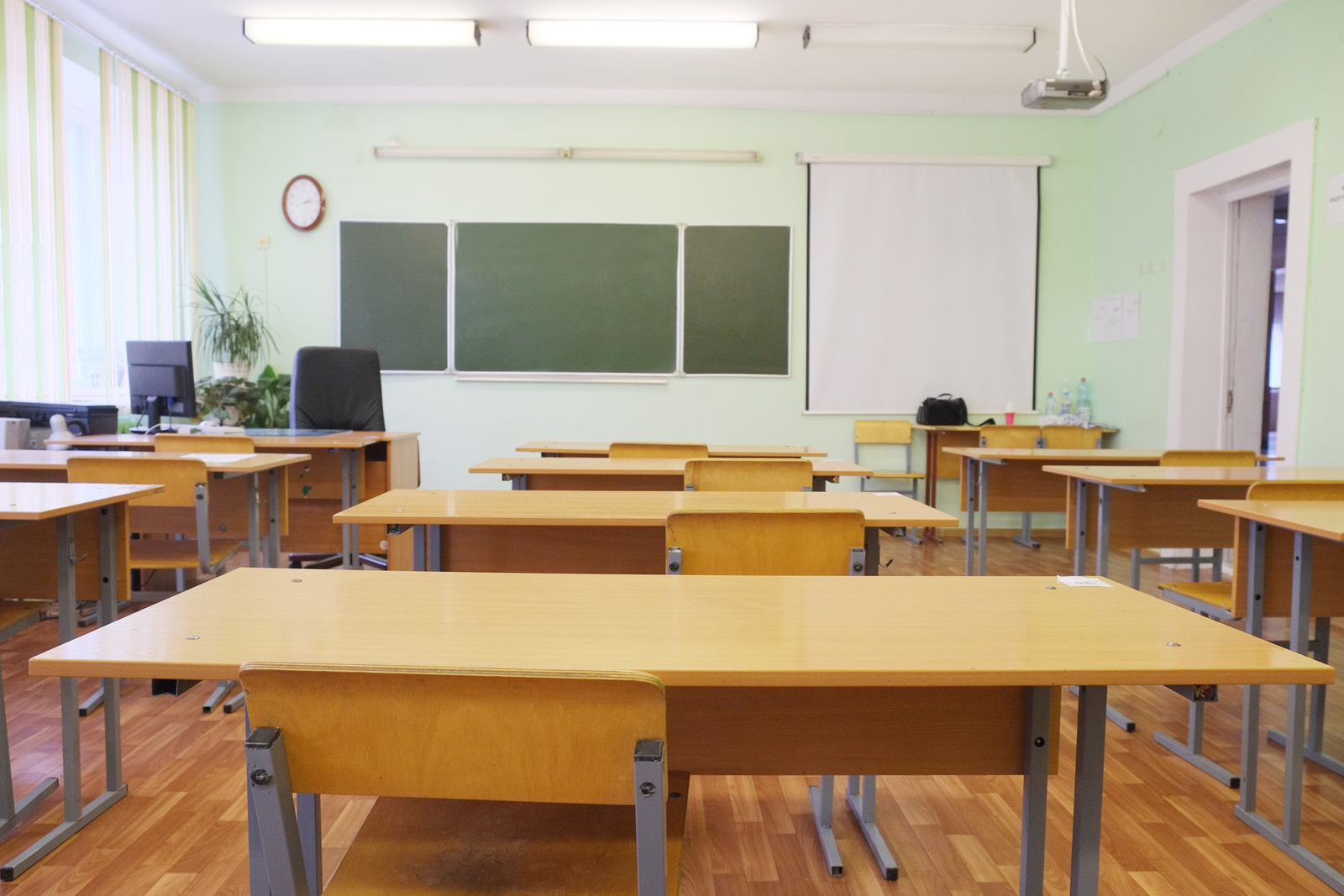 Traditional empty classroom contrasted with hands-on learning approach